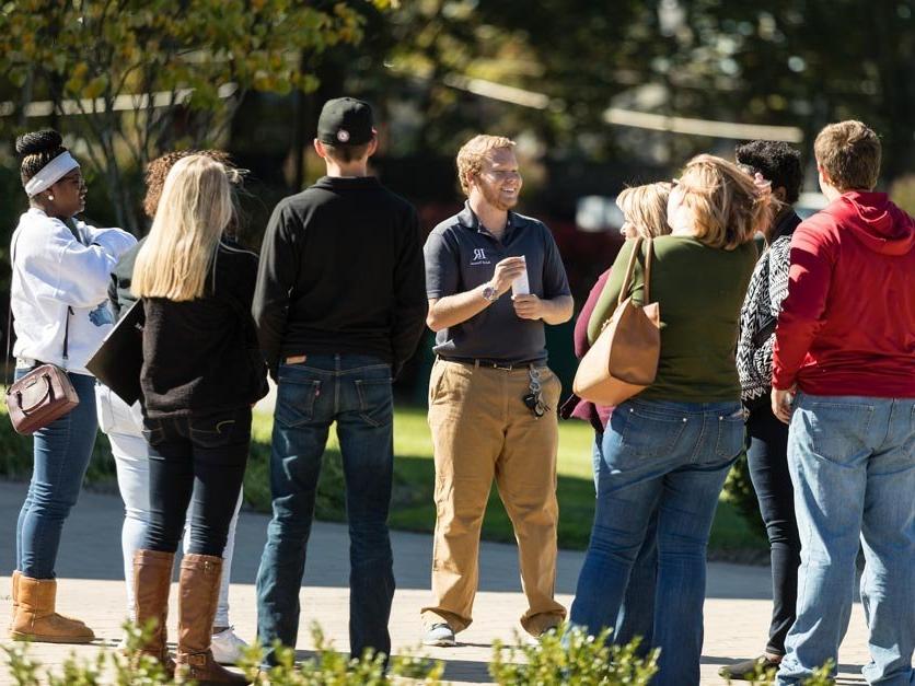 Prospective students and parents take part in a campus tour